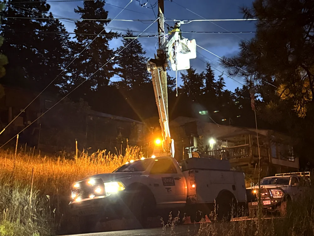 Night emergency restoration with bucket truck lights on