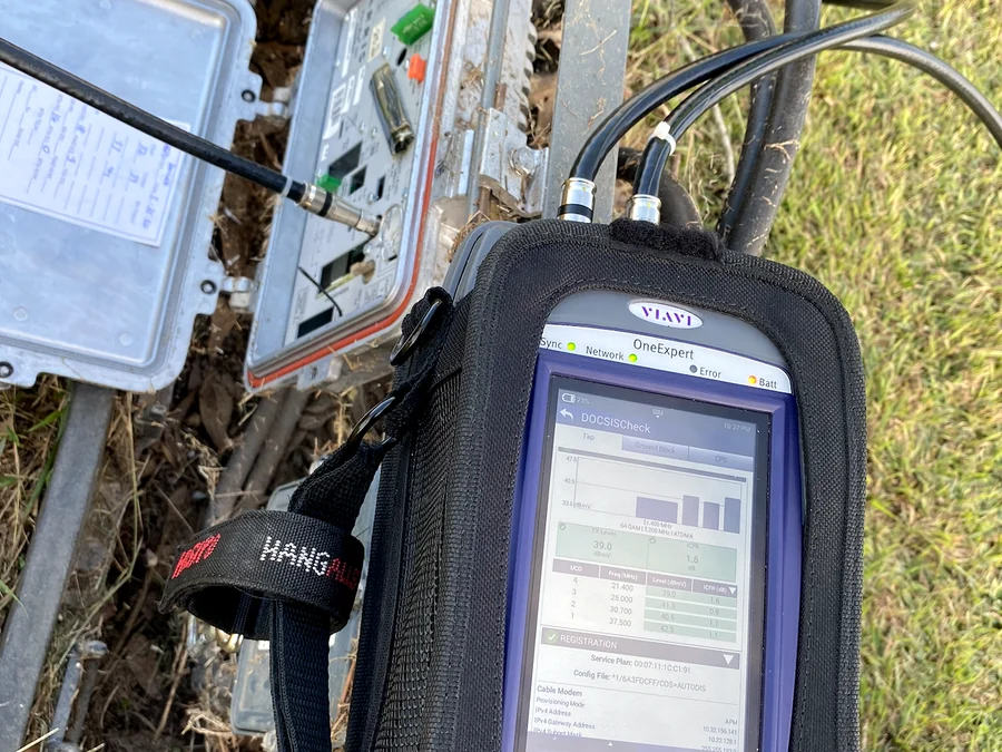 VIAVI OneExpert meter certifying signal levels at a node enclosure
